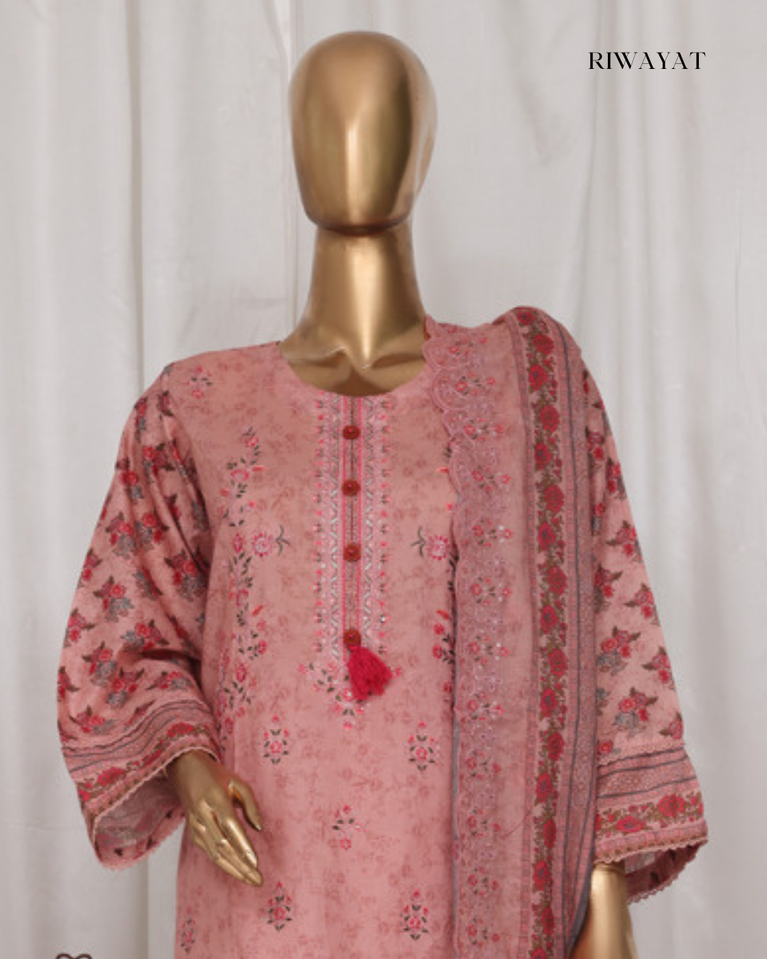 Mannequin wearing a pink floral embroidered outfit with 'RIWAYAT' branding.