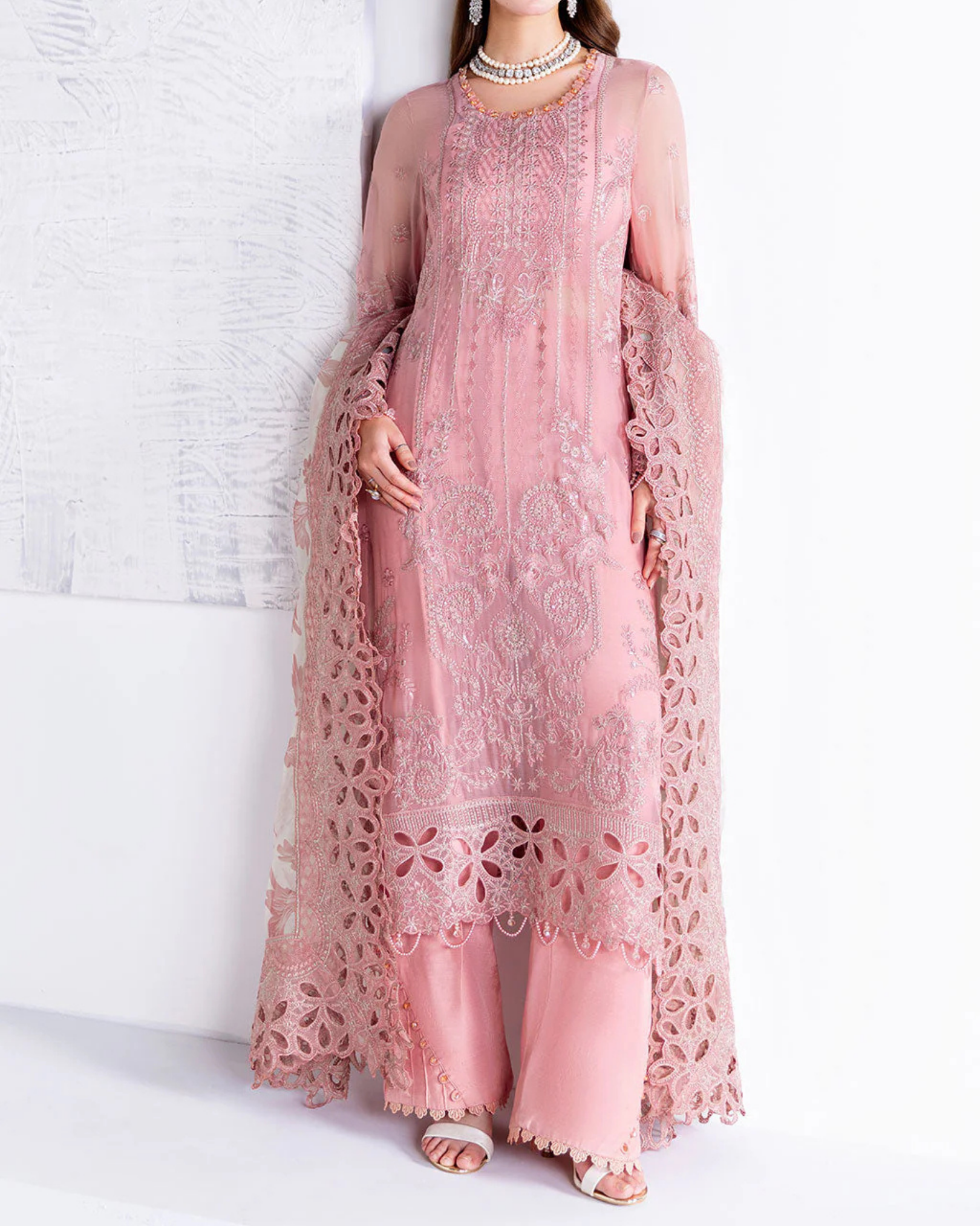 Pink lace outfit on a white background
