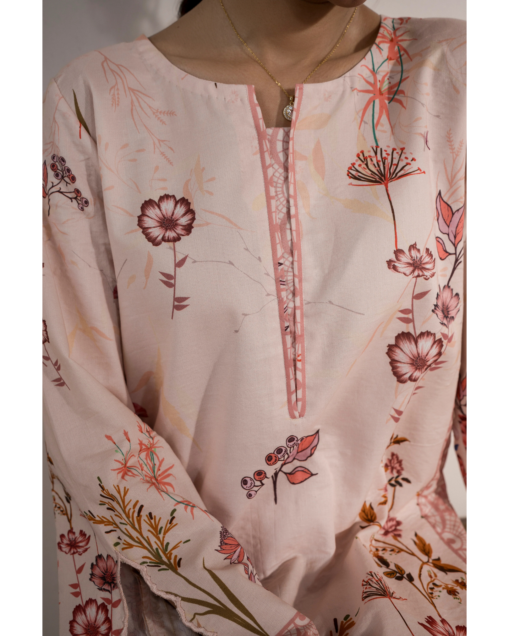 Floral embroidered top with a close-up on the neckline