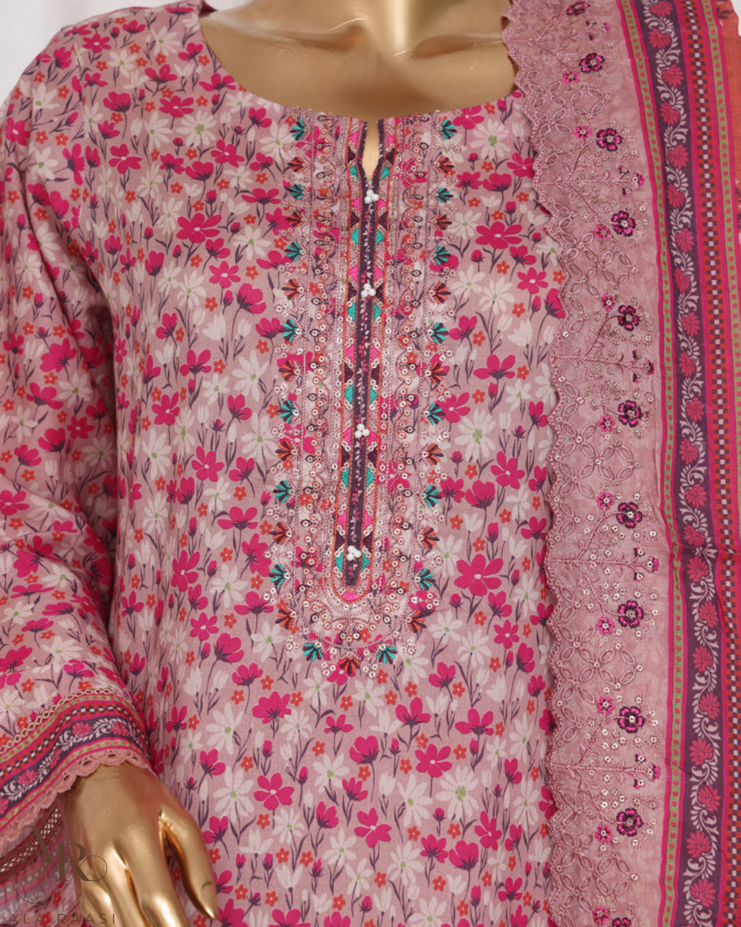 Floral patterned dress with a pink border on a mannequin