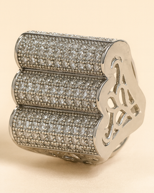 Decorative ring with intricate design on a beige background