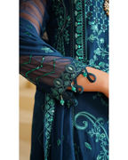 Navy blue embroidered garment with green details on a plain background