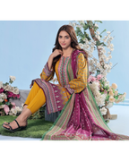 Woman in a colorful traditional outfit sitting among flowers with a clear blue sky background