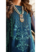 Navy blue embroidered dress with intricate patterns and a necklace.
