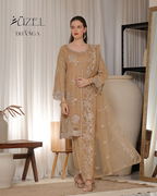Woman wearing a beige embroidered outfit in a room with white curtains and a wooden table.