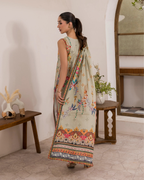 Woman wearing a traditional saree in a home setting