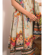 Traditional outfit with colorful patterns on a neutral background