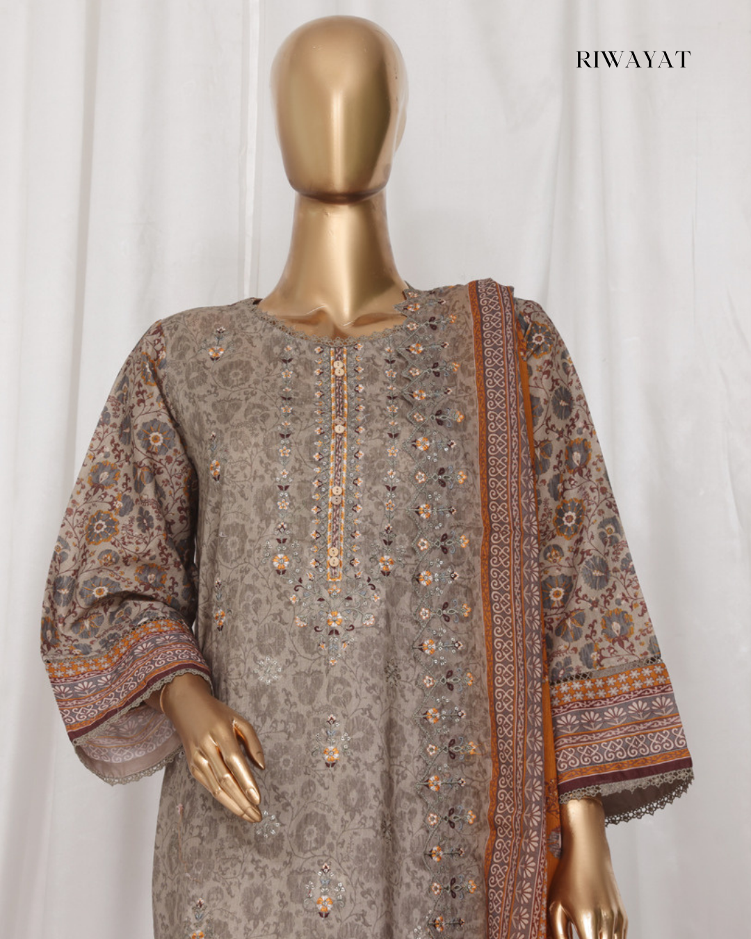 Mannequin wearing a patterned shirt with a matching dupatta against a white background, branded 'RIWAYAT'.