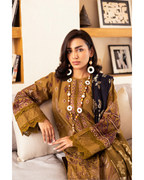 Woman in traditional embroidered outfit sitting on a couch in a home setting