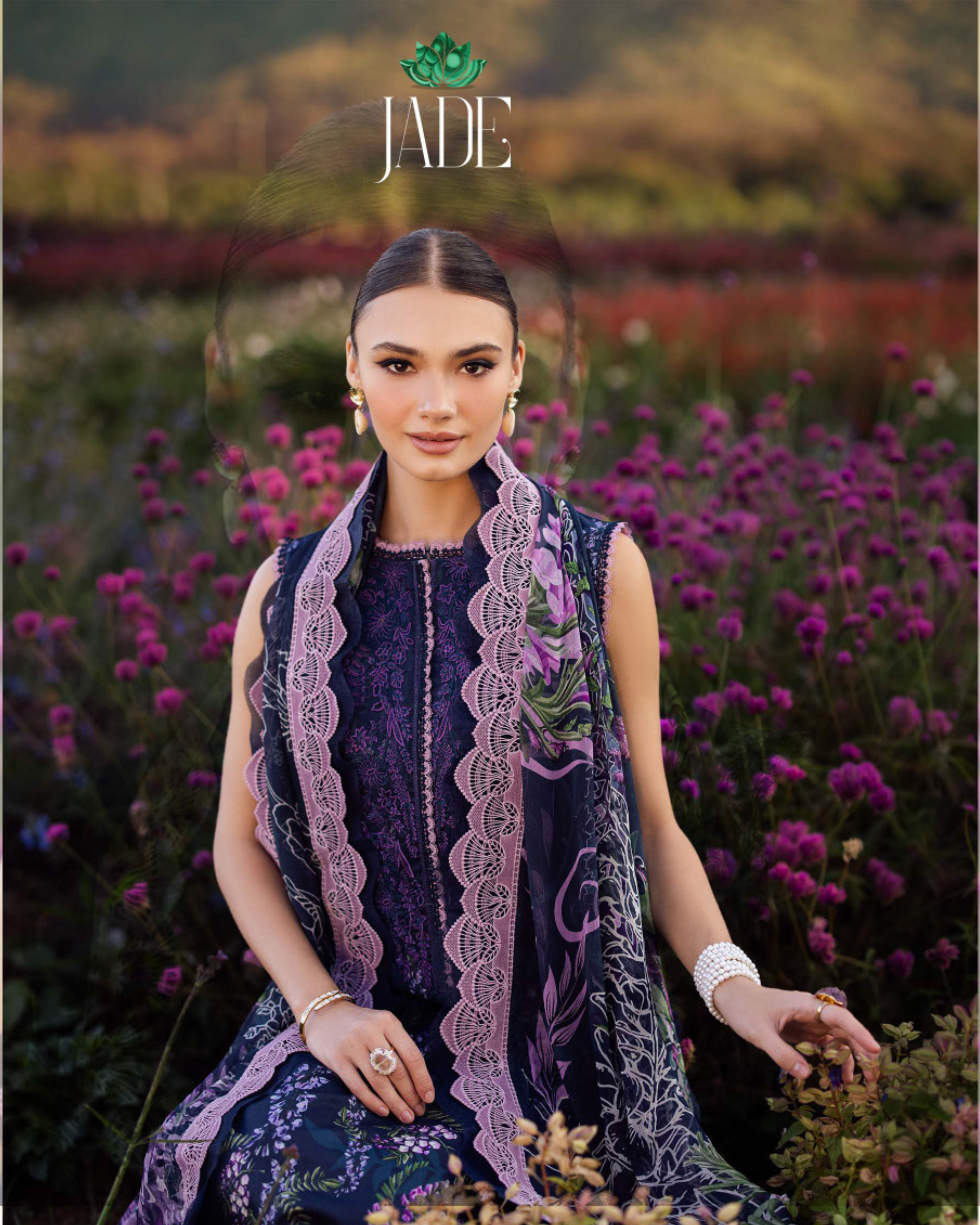 Woman in a purple dress with lace details standing in a field of purple flowers, with 'JADE' branding.