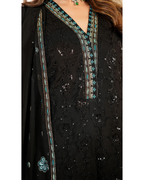 Black embroidered dress with turquoise details on a white background