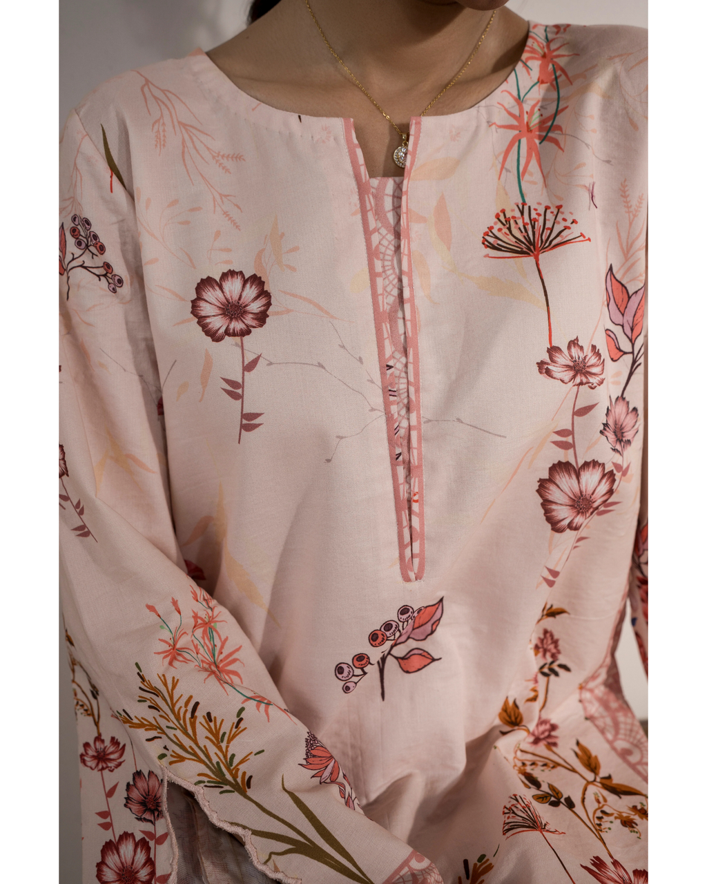 Floral embroidered top with a close-up on the neckline