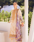 Woman wearing a patterned dress with a blurred outdoor background