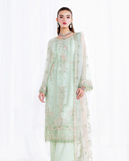 Light green embroidered traditional outfit on a white background