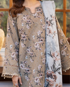 Floral patterned outfit with matching scarf against a blurred indoor background