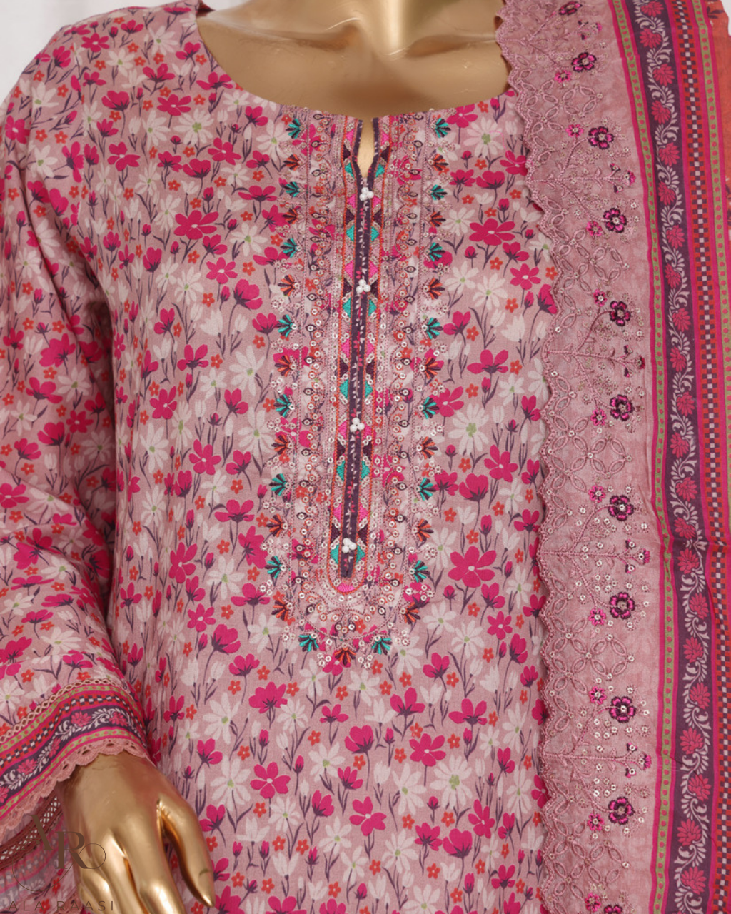 Floral patterned dress with a pink border on a mannequin
