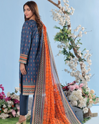 Woman wearing a blue and orange traditional outfit with a floral background
