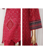 Red patterned garment on a mannequin with a white background