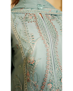 Light blue embroidered fabric with intricate patterns on a plain background