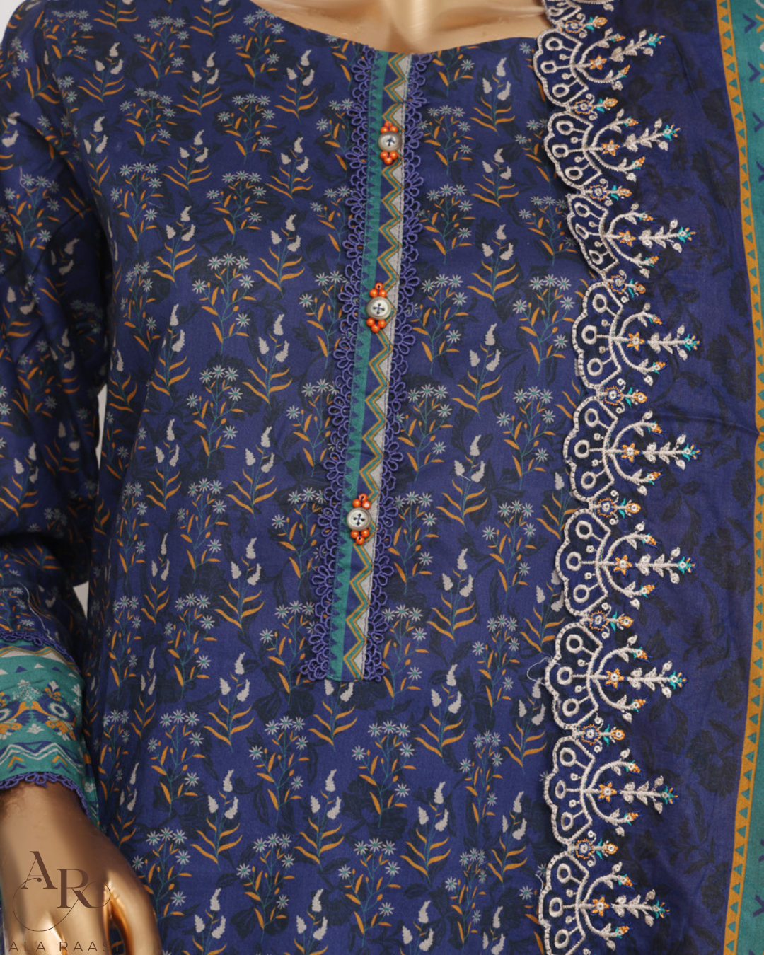 Blue embroidered garment with intricate patterns on a mannequin