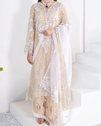 Beige embroidered dress with a white dupatta on a white background