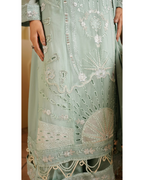 Light green embroidered traditional outfit with intricate patterns