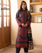 Woman wearing a black and red embroidered traditional outfit with JOHRA branding.