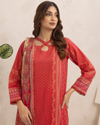Woman wearing a red traditional outfit with a beige background