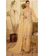 Woman in a beige embroidered traditional outfit standing in a room with decorative elements.