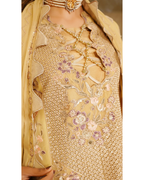 Beige embroidered traditional outfit with floral patterns