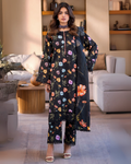 Woman wearing a floral outfit in a living room setting