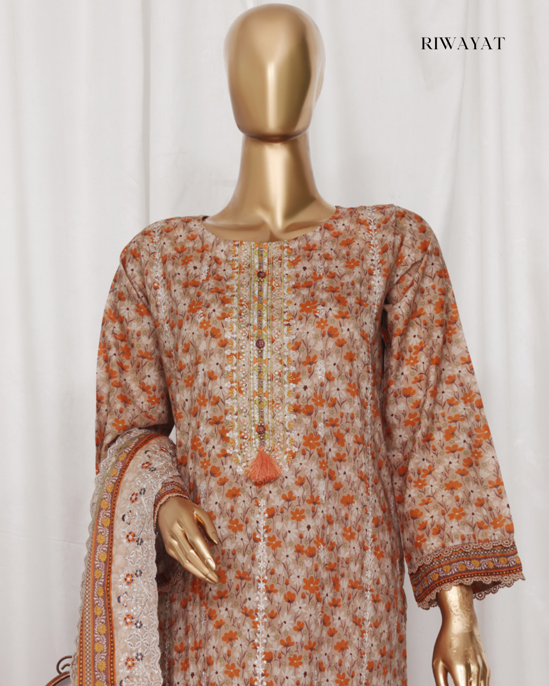 Floral patterned dress on a mannequin with 'RIWAYAT' branding.