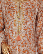 Floral patterned garment with orange flowers on a beige background
