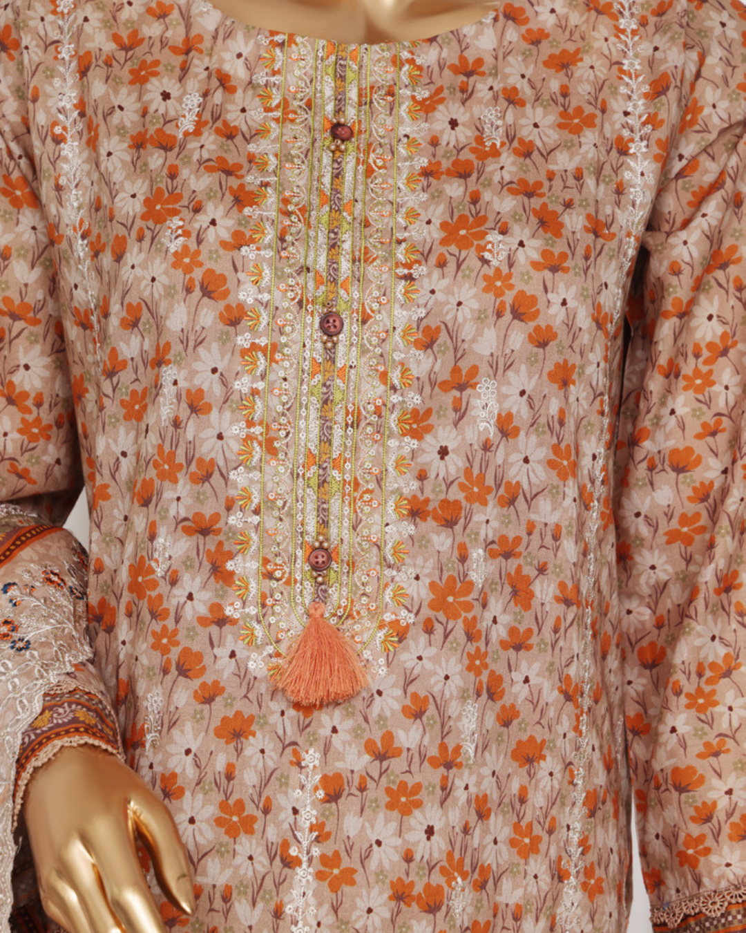 Floral patterned garment with orange flowers on a beige background