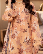 Floral embroidered dress with intricate patterns on a neutral background