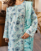 Light blue floral dress with lace details worn by a person indoors.