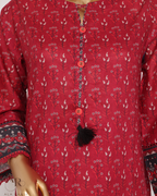 Red patterned kurta on a mannequin with visible branding.