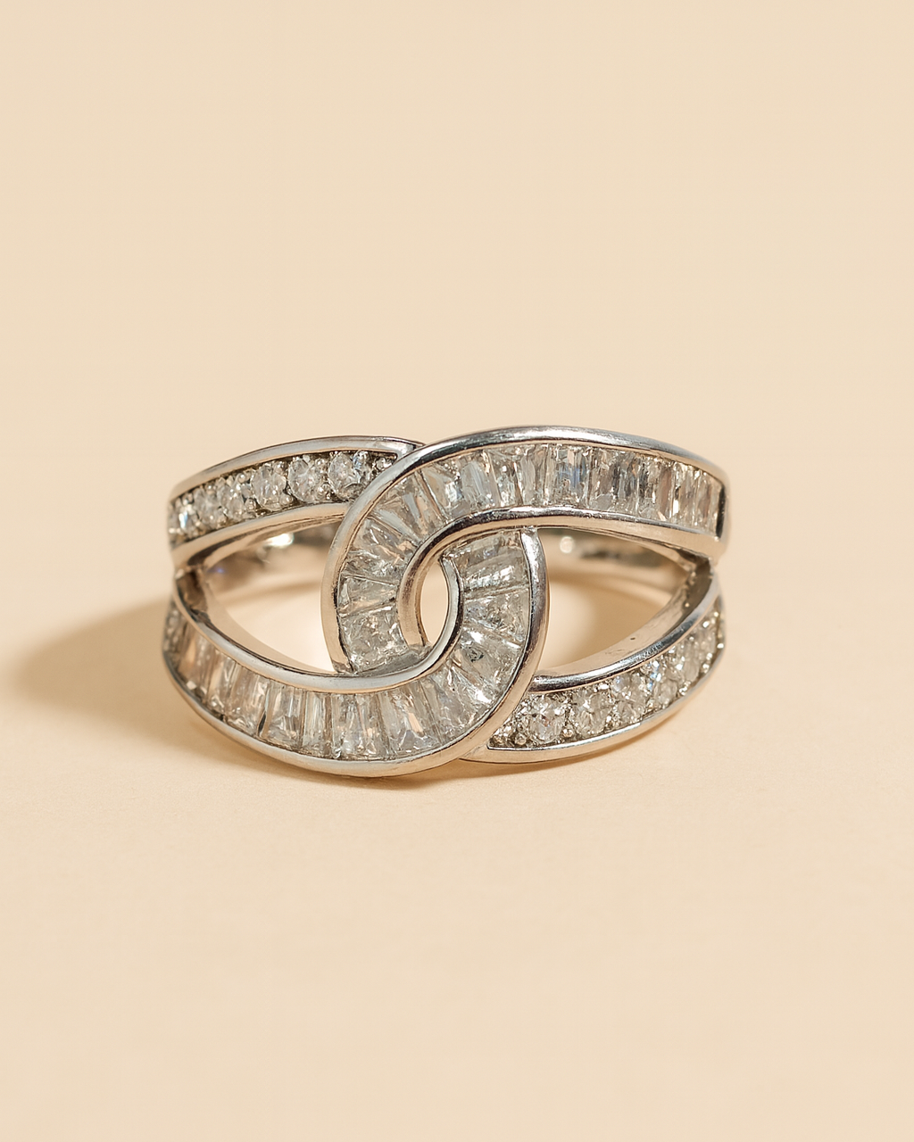 Artificial Anti-Tarnish silver ring with diamond accents on a beige background